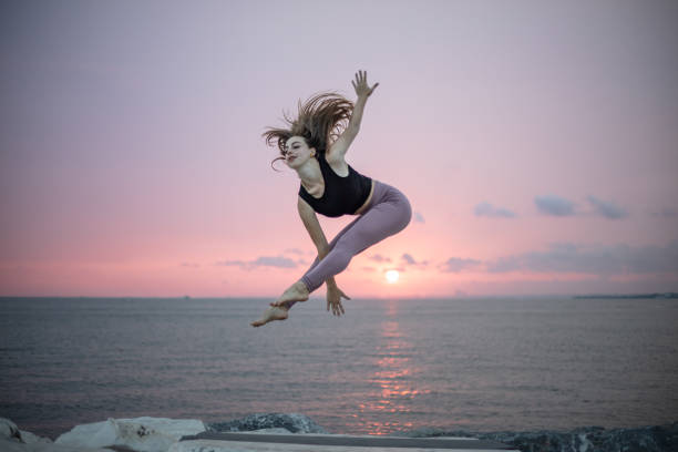 Blonde athlete is training on t he outside at sunset.