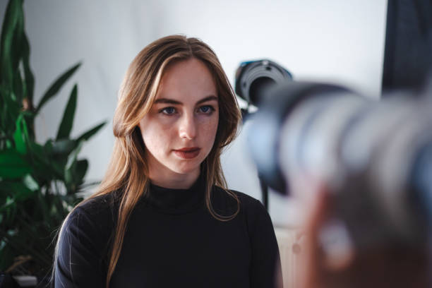 istock Young blonde woman in studio photoshoot. 2185106036