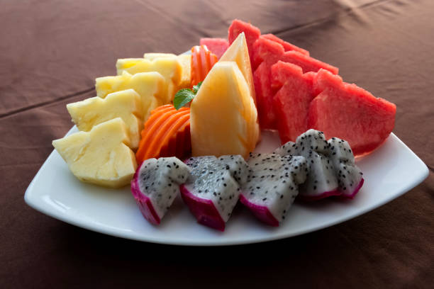 istock Mixed fruits on a white plate 2185106785
