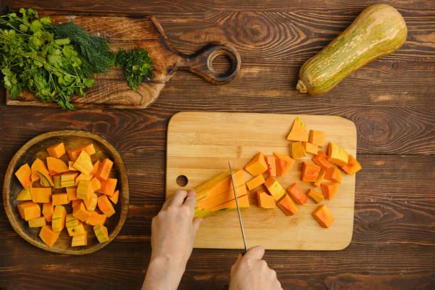 istock Chopping fresh squash and herbs on a wooden countertop in a cozy kitchen 2185107939