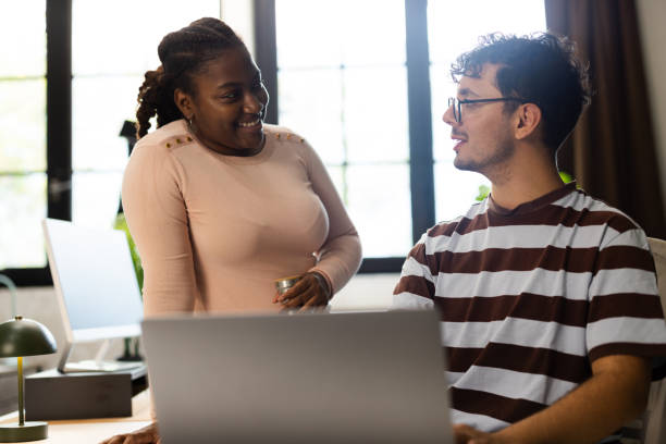istock A duo of employees sharing insights during a work session 2185108102
