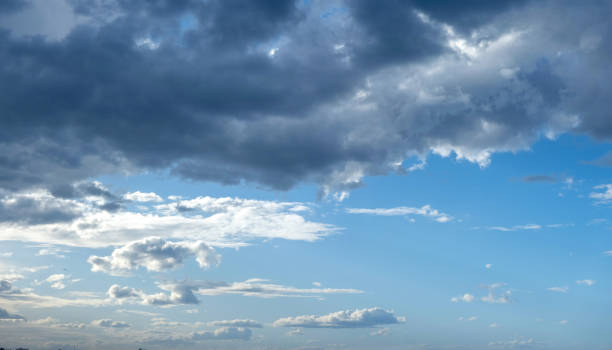 istock Fluffy cumulus clouds on blue sky, White and grey color cloudscape 2185109109