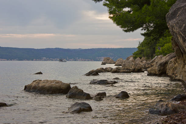 A rocky shore on the Adriatic Sea. Landscape with sea and mountains