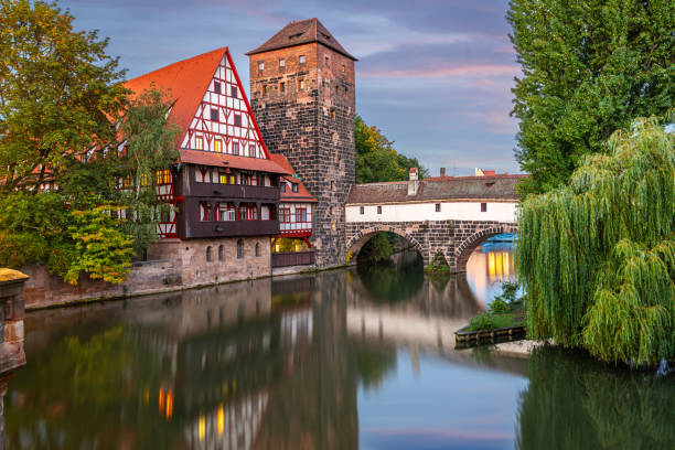 Nuremburg, Germany with Hangman's Bridge on the Pegnitz River at dusk.