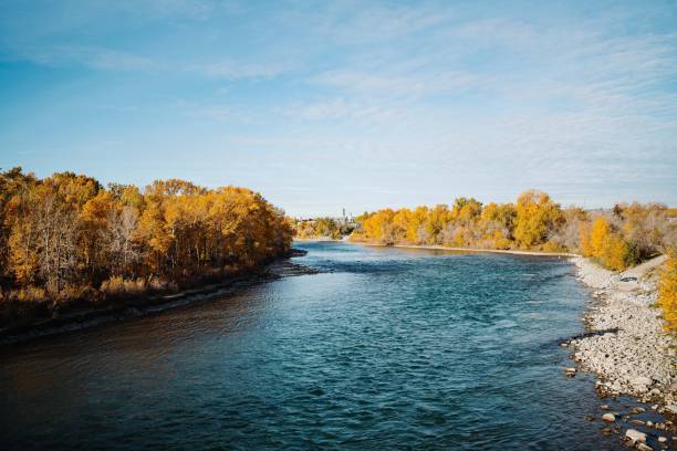istock Serene river with autumn trees and clear sky 2185112424