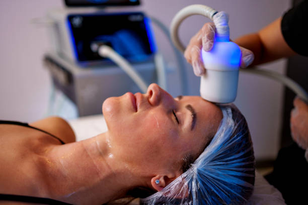 Woman Receiving Cryolipolysis Treatment at a Beauty Clinic stock photo