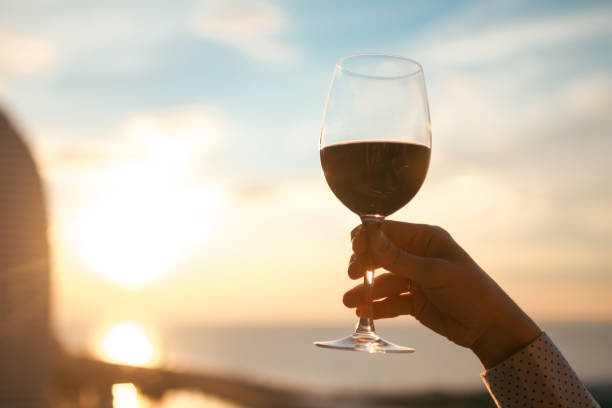 istock A glass of red wine at sunset 2185121819