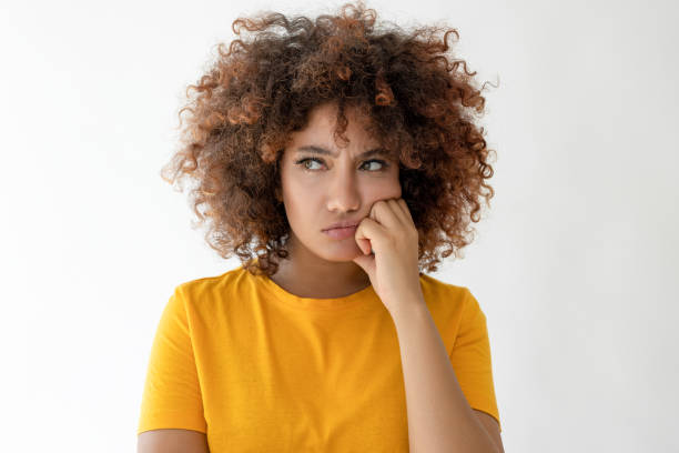 istock Thoughtful woman looking away with hand on chin 2185121863