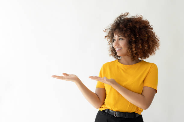 istock Young woman smiling with her hands showing 2185122170