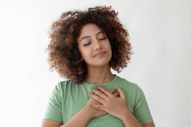 istock Young woman crossing her hands on her chest 2185122267
