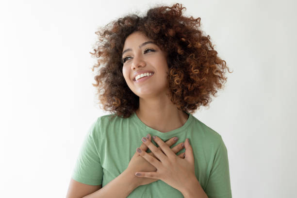 istock Young woman crossing her hands on her chest smiling 2185122406