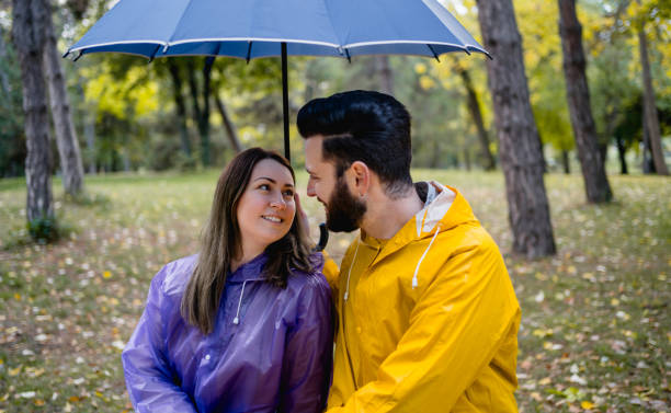 istock Young couple in love on a rainy day 2185124030