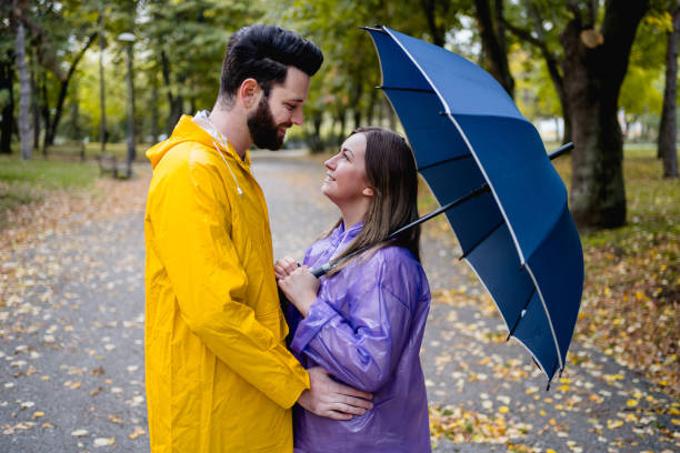 istock Couple in love on a rainy day 2185124097
