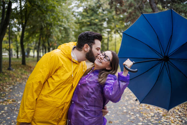 Young couple in love on a rainy day