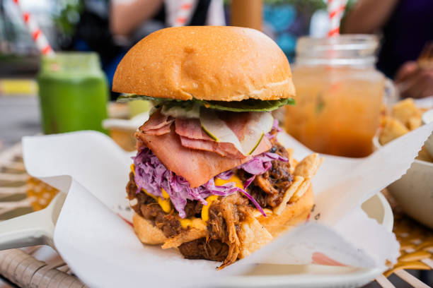 istock Close-up of a big hamburger at restaurant 2185124328