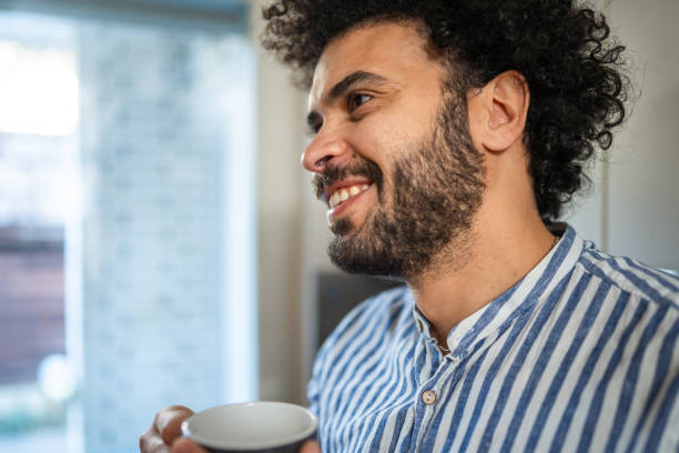 istock Relaxed Middle Eastern Man Enjoying Coffee at Home 2185124966