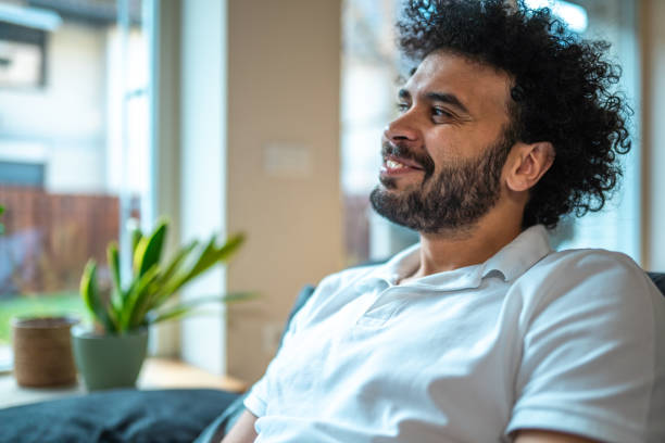 istock Middle Eastern Man Relishing Ice Cream at Home 2185125020