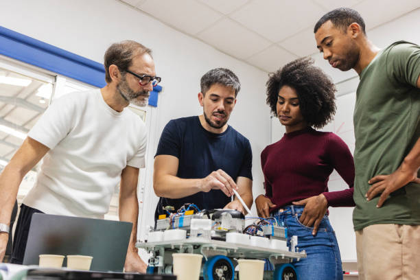 istock Engineers working on a robotics project in modern factory 2185127953