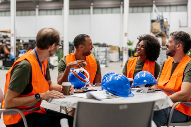 istock Multiracial engineers having a coffee break in factory 2185128113