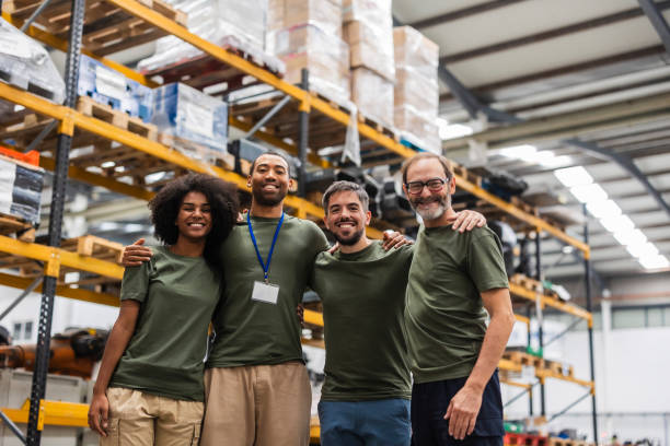 istock Robotics engineers smiling together in a modern factory 2185128183