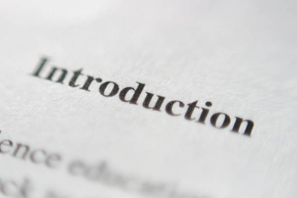 A detailed macro shot focusing on the word Introduction on the page of a book, emphasizing the texture of the paper and the sharpness of the text