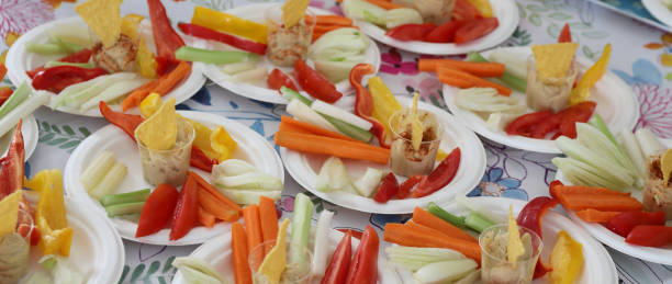 istock vegetarian appetizer with chickpea hummus peppers carrots and celery served on plates 2185130266