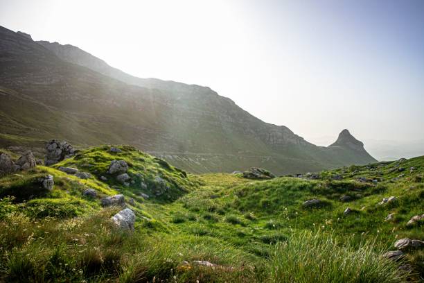 istock Scenic lush green mountain landscape under bright sky 2185131098