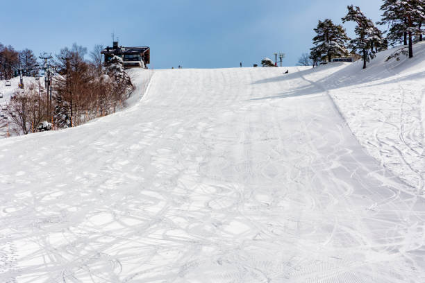 istock Spectacular snow covered mountain backdrop at a ski resort (Madarao) 2185131100