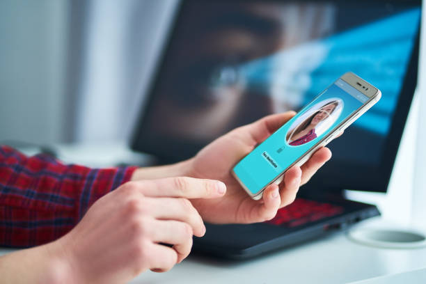 istock Woman unlocking smartphone using facial recognition technology system. Biometric verification identification and face id scanning. High tech technology 2185134943