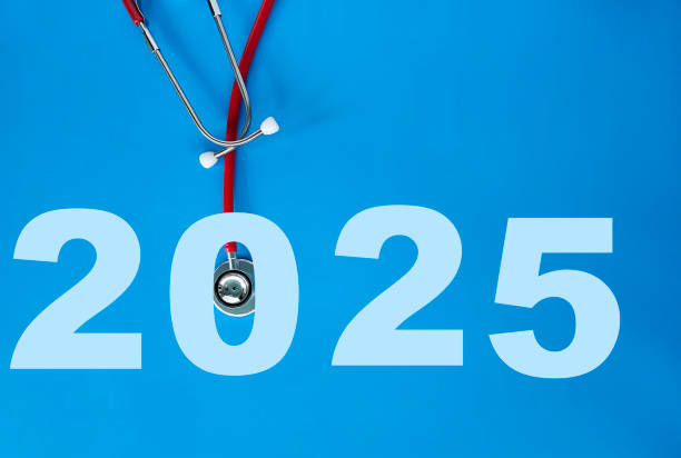 istock Stethoscope resting on blue background with the year 2025 displayed in large numbers representing healthcare 2185135126