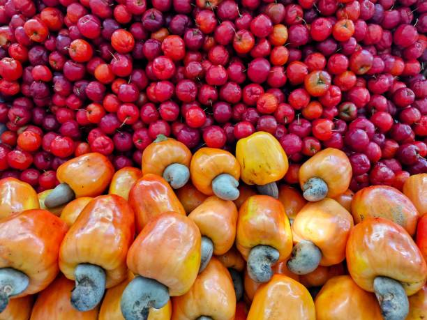 Fruits (cashews and acerolas) being sold at a street fair