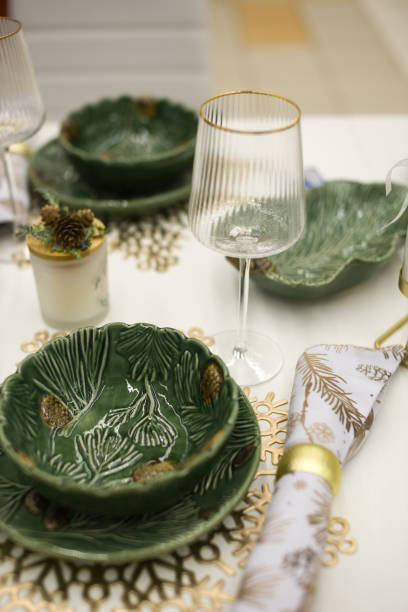 istock New Year's table setting. festive tableware and romantic candles, cutlery 2185137303