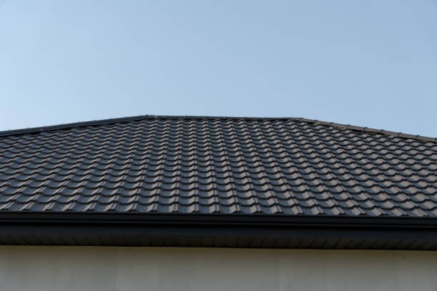 istock A striking roof adorned with patterned tiles reflects modern design, contrasting beautifully with the bright blue sky above. The geometry creates a sense of harmony and structure 2185137960