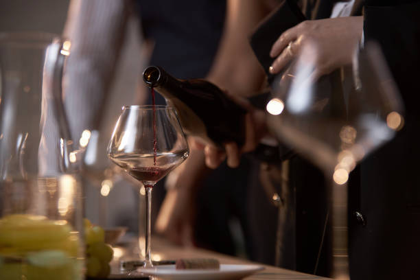 istock Unrecognizable Woman Pouring Wine 2185140392