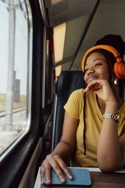 istock Young woman traveling by train 2185143676