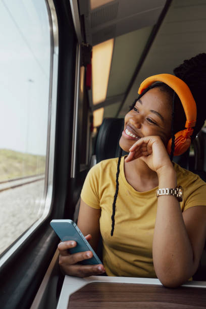 istock Young woman traveling by train 2185143682