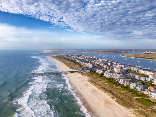 istock Swirls in the surf left by the waves 2185145000
