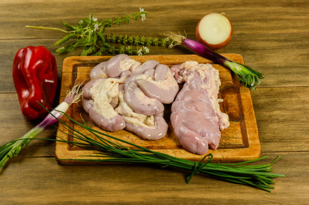 istock Cow bowels presented on a wooden board with ingredients, ready to grill 2185150228