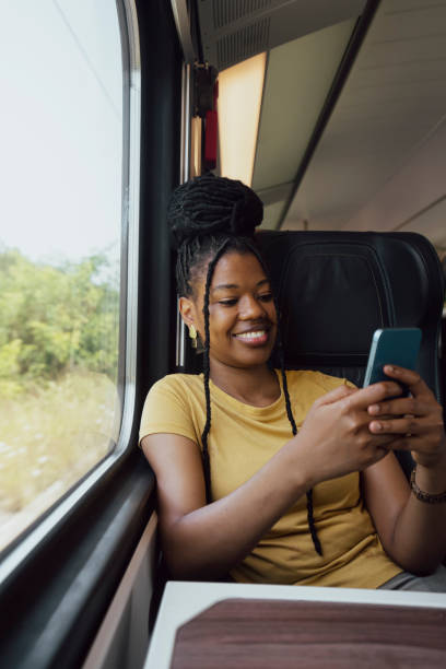 istock Young woman traveling by train 2185150298