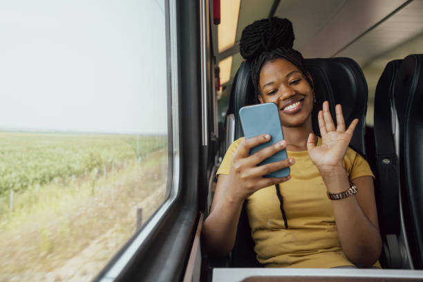 istock Young woman traveling by train 2185150300