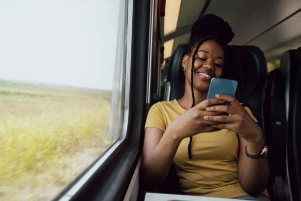 istock Young woman traveling by train 2185150326