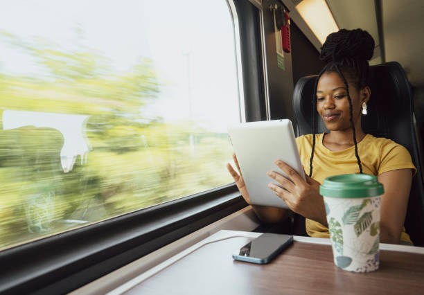 istock Young woman traveling by train 2185150927