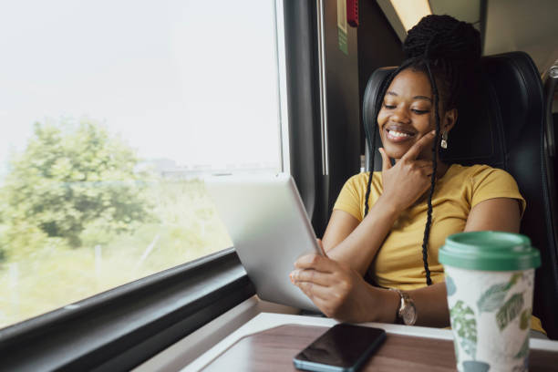istock Young woman traveling by train 2185150929