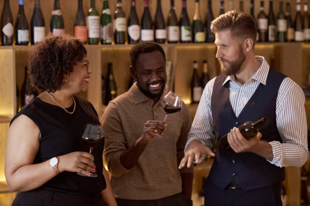 istock Sommelier Community Telling Jokes in Wine Cellar 2185151451