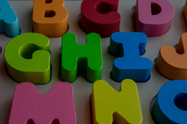 wooden educational letters, scattered letters create a background