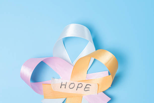 istock Three ribbons with the word hope on a blue background. 2185152551