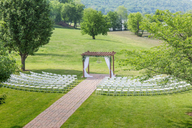 istock Elegant Outdoor Wedding Setup with Floral Decorations and Scenic Backdrop 2185153092