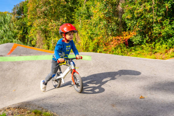 istock A young boy is riding a bike on a dirt track 2185154705