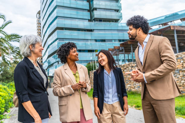istock Diverse business team talking standing in the city 2185158051