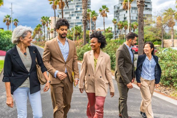 istock Business people walking along the city after work 2185158159